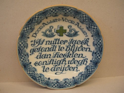 Bord met spreuk in opdracht van het Groene Kruis
