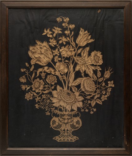 Papierknipsel op zwarte ondergrond, voorstellende een vaas met bloemen