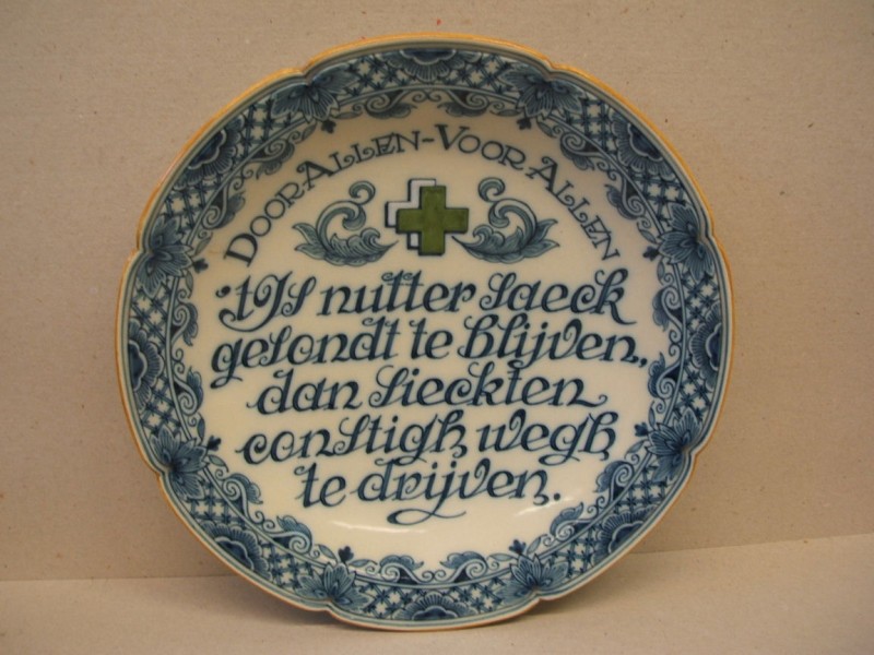 Bord met spreuk in opdracht van het Groene Kruis